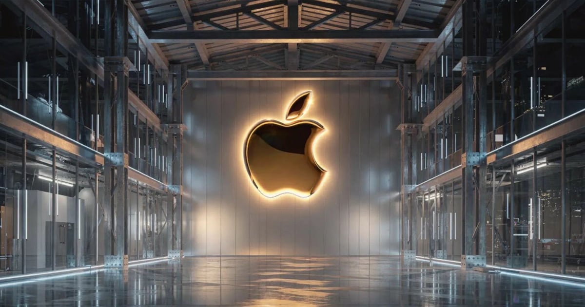 Glowing gold Apple logo mounted on a metallic wall inside a modern glass-and-steel interior with reflective floors and symmetrical industrial framing.