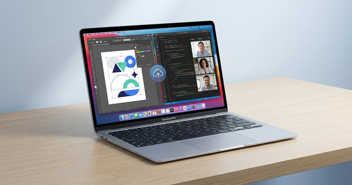 MacBook Pro on a wooden desk displaying design software, coding editor, and video call windows for professional workflow