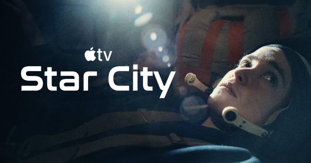 A cosmonaut lies strapped into a dim spacecraft capsule with a headset microphone at her chin, lit by a single bright lamp, with the Apple TV logo and the title "Star City" in white to the left.